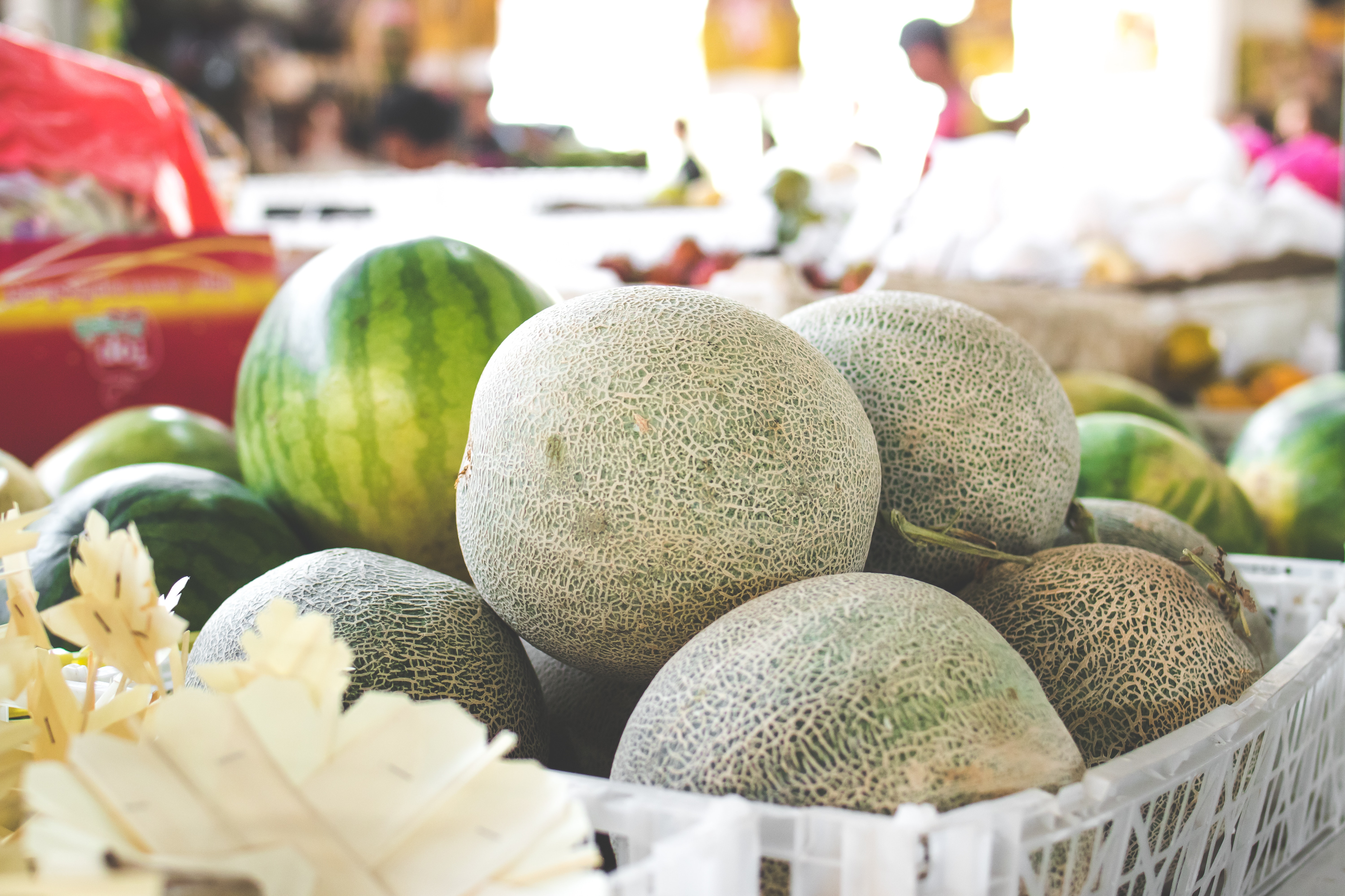 photo-of-melons-on-white-plastic-basket-1100419